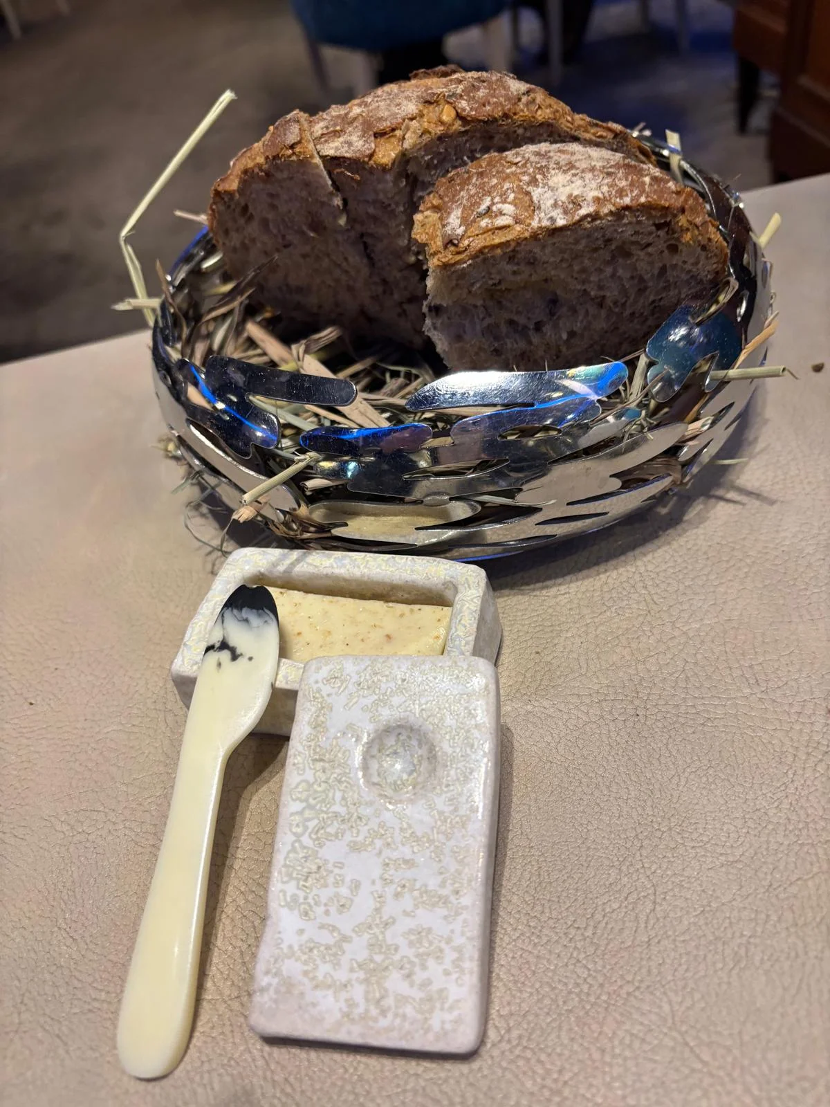 Beurre de Madame in its signature ceramic pot with the marbled ceramic spoon, presented at a private Breton tasting