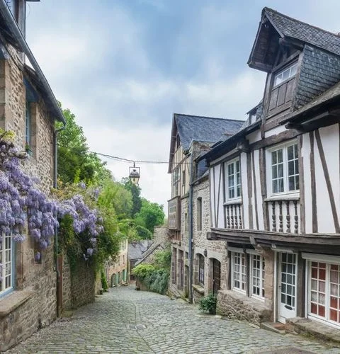Dinan half-timbered facades narrow medieval lanes picturesque Brittany