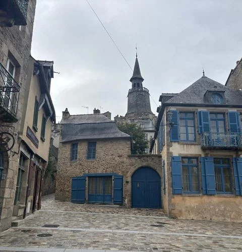 Dinan cobblestone streets colorful medieval houses historic center Brittany