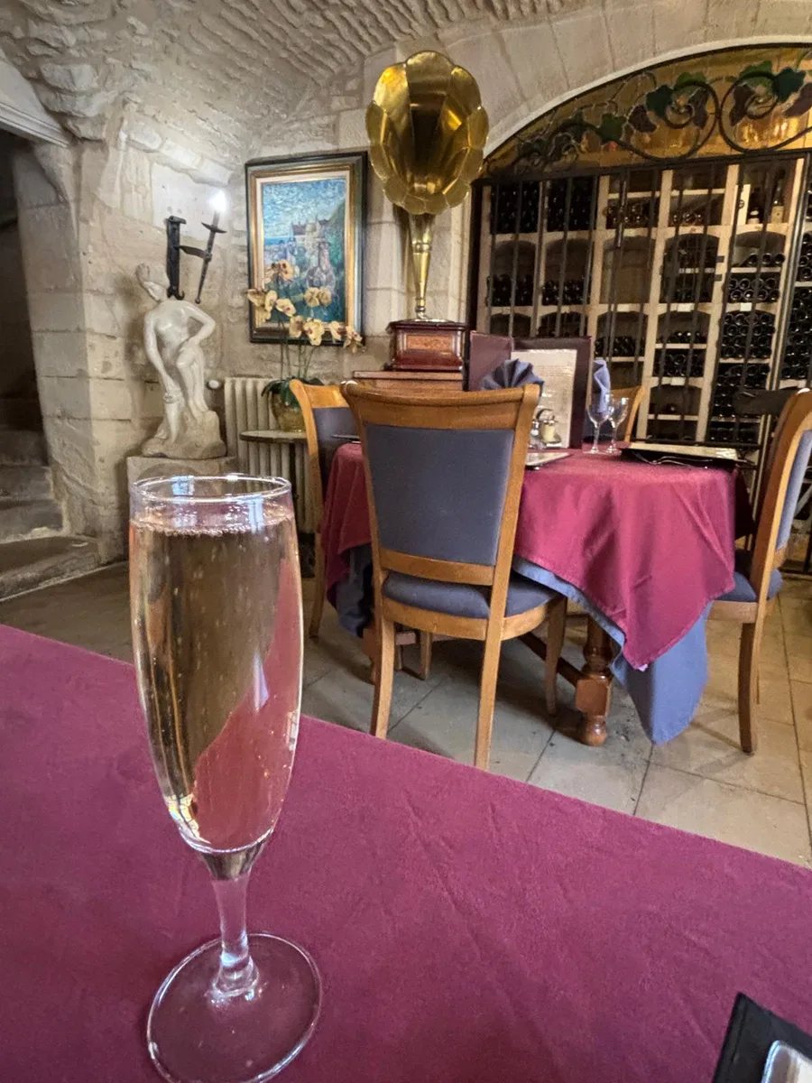 A flute of champagne in the vaulted cellar dining room